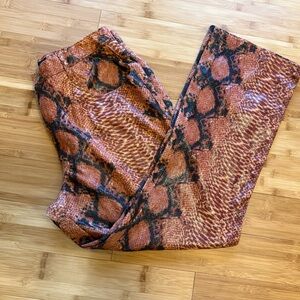 Snakeskin flare jeans by Revolt